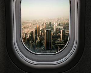 Preview wallpaper porthole, city, skyscrapers, aerial view, window