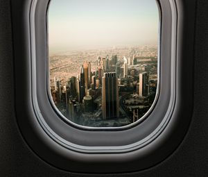 Preview wallpaper porthole, city, skyscrapers, aerial view, window