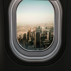 Preview wallpaper porthole, city, skyscrapers, aerial view, window