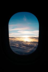 Preview wallpaper porthole, clouds, sunset, black