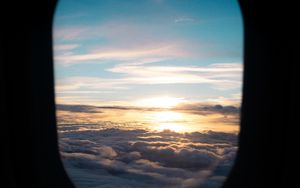 Preview wallpaper porthole, clouds, sunset, black