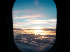 Preview wallpaper porthole, clouds, sunset, black