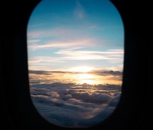Preview wallpaper porthole, clouds, sunset, black