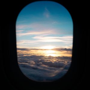 Preview wallpaper porthole, clouds, sunset, black