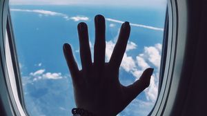 Preview wallpaper porthole, hand, airplane, window, clouds