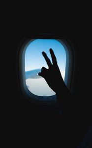 Preview wallpaper porthole, hand, gesture, sky