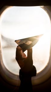 Preview wallpaper porthole, paper airplane, window, sunlight