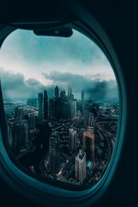 Preview wallpaper porthole, window, city, aerial view