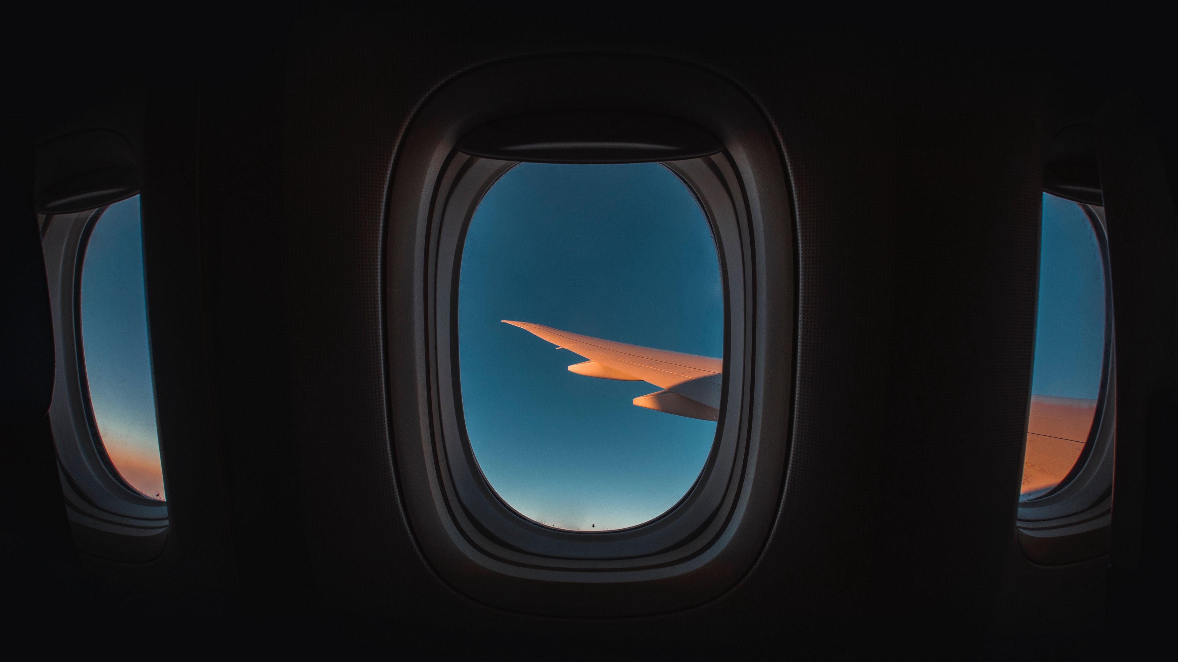 Download wallpaper 3840x2160 porthole, window, plane, wing, sky, flight 4k  uhd 16:9 hd background