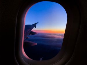Preview wallpaper porthole, window, plane, flight, airplane wing, sky