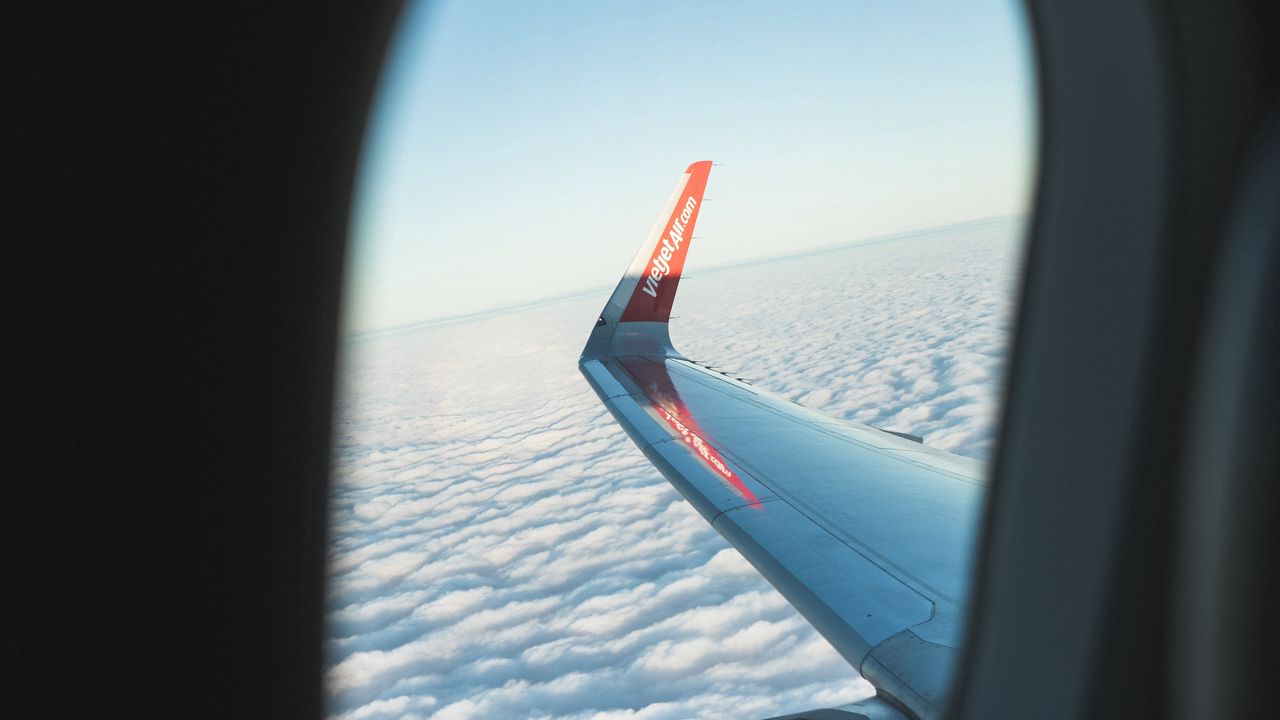 Wallpaper porthole, window, plane, wing, clouds, view