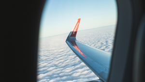 Preview wallpaper porthole, window, plane, wing, clouds, view