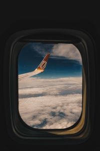 Preview wallpaper porthole, window, wing aircraft, flight, clouds