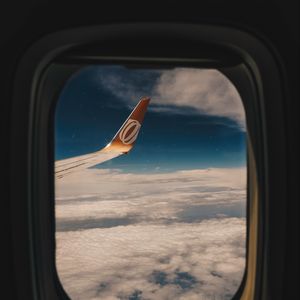 Preview wallpaper porthole, window, wing aircraft, flight, clouds