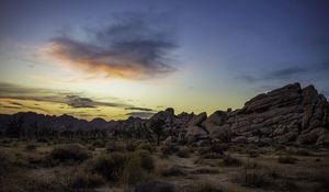 Preview wallpaper prairie, rocks, trees, bushes, sunset