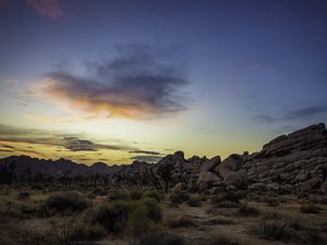 Preview wallpaper prairie, rocks, trees, bushes, sunset