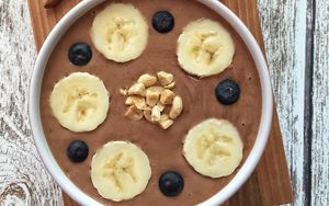 Preview wallpaper pudding, bananas, blueberries, nuts
