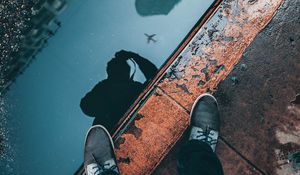 Preview wallpaper puddle, border, legs, reflection, photographer, sidewalk