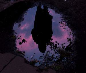 Preview wallpaper puddle, reflection, silhouette, alone, dark, water