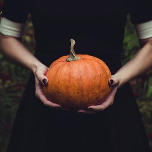 Preview wallpaper pumpkin, hands, girl