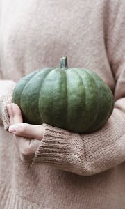 Preview wallpaper pumpkin, hands, sweater, autumn