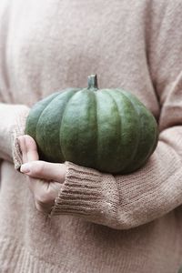 Preview wallpaper pumpkin, hands, sweater, autumn