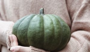 Preview wallpaper pumpkin, hands, sweater, autumn