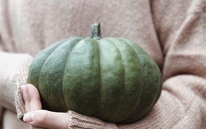 Preview wallpaper pumpkin, hands, sweater, autumn