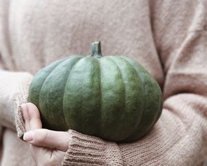 Preview wallpaper pumpkin, hands, sweater, autumn