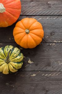 Preview wallpaper pumpkins, autumn, boards, wood