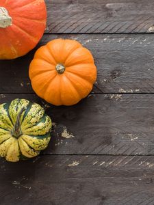 Preview wallpaper pumpkins, autumn, boards, wood