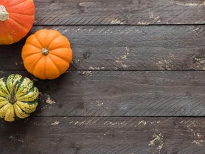Preview wallpaper pumpkins, autumn, boards, wood