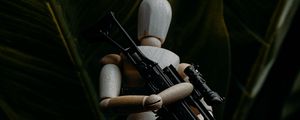 Preview wallpaper puppet, figurine, machine gun, weapon