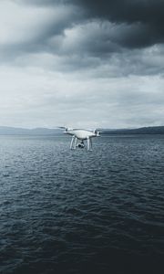 Preview wallpaper quadcopter, drone, quadrotor helicopter, quadrotor, sea, fog, clouds