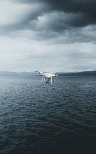 Preview wallpaper quadcopter, drone, quadrotor helicopter, quadrotor, sea, fog, clouds