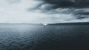 Preview wallpaper quadcopter, drone, quadrotor helicopter, quadrotor, sea, fog, clouds