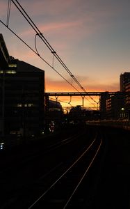 Preview wallpaper railroad, rails, dark, city, dusk