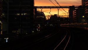 Preview wallpaper railroad, rails, dark, city, dusk