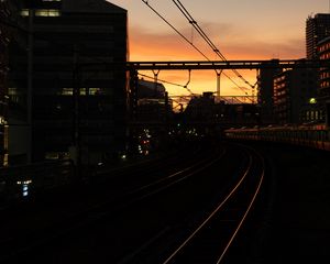 Preview wallpaper railroad, rails, dark, city, dusk