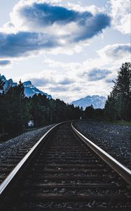 Preview wallpaper railroad, rails, mountains, trees, clouds