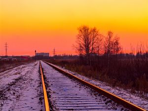 Preview wallpaper railroad, rails, snow, sunset