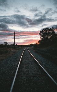 Preview wallpaper railroad, rails, sunset, pebbles, turn