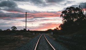 Preview wallpaper railroad, rails, sunset, pebbles, turn
