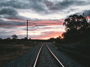 Preview wallpaper railroad, rails, sunset, pebbles, turn