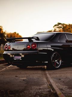 Download wallpaper 240x320 railroad, skyline, r34, nissan, gtr, black, side  view old mobile, cell phone, smartphone hd background