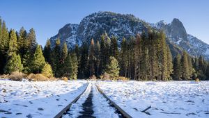 Preview wallpaper railroad, snow, glade, trees, mountains