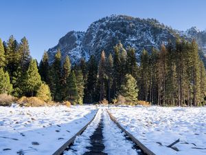 Preview wallpaper railroad, snow, glade, trees, mountains