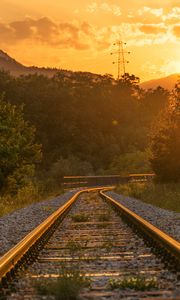 Preview wallpaper railroad, trees, sunlight, sunset