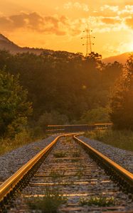 Preview wallpaper railroad, trees, sunlight, sunset