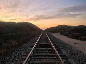 Preview wallpaper railroad, trees, twilight, landscape